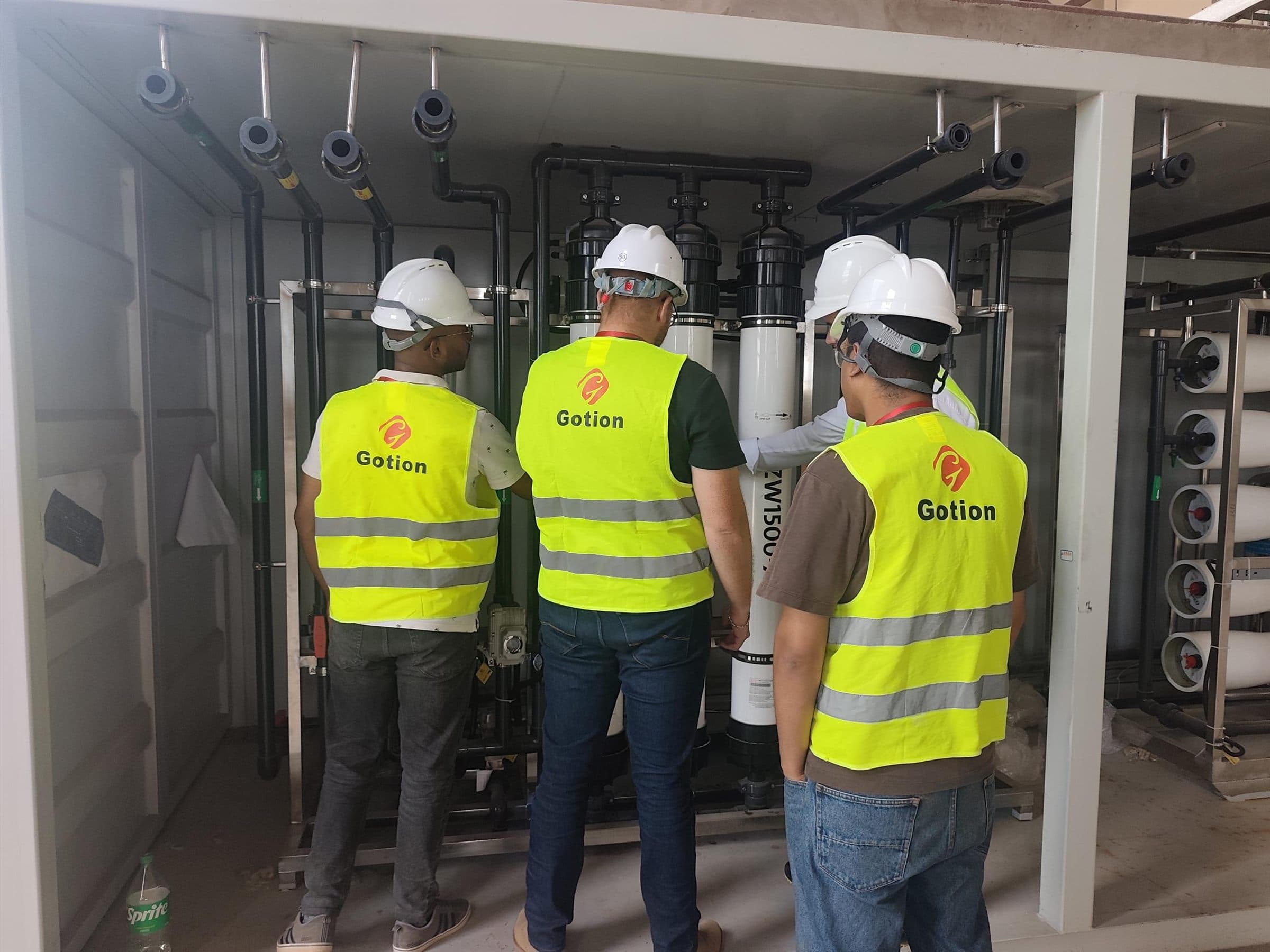 Team inspecting a pure-water system during site work