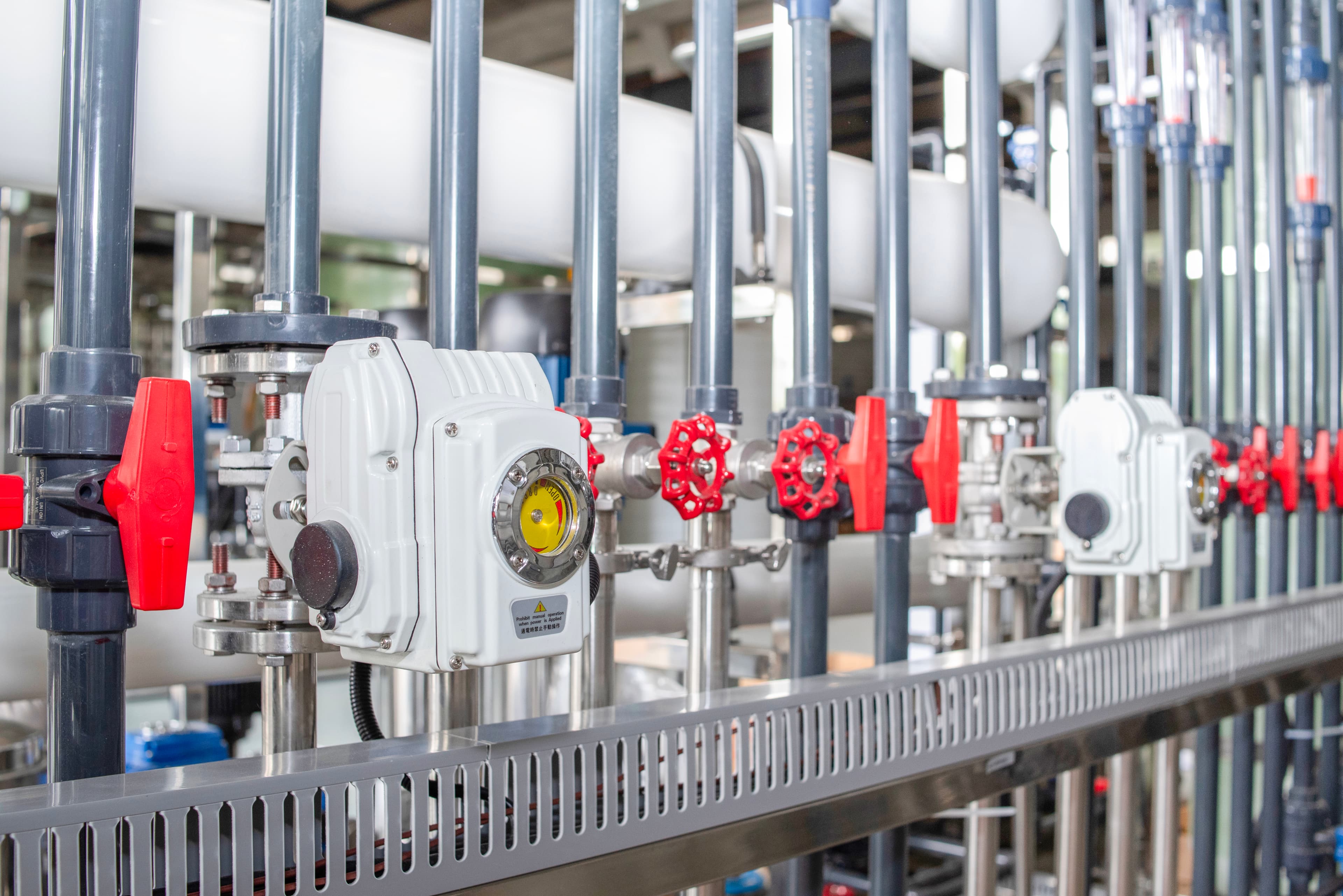 Instrumented water-treatment valve manifold for controlled industrial water supply